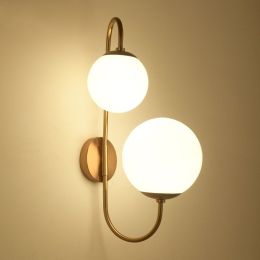 Modern Chic Milky White Globe Glass Shade Two-Light Indoor Wall Lamp in Aged Brass